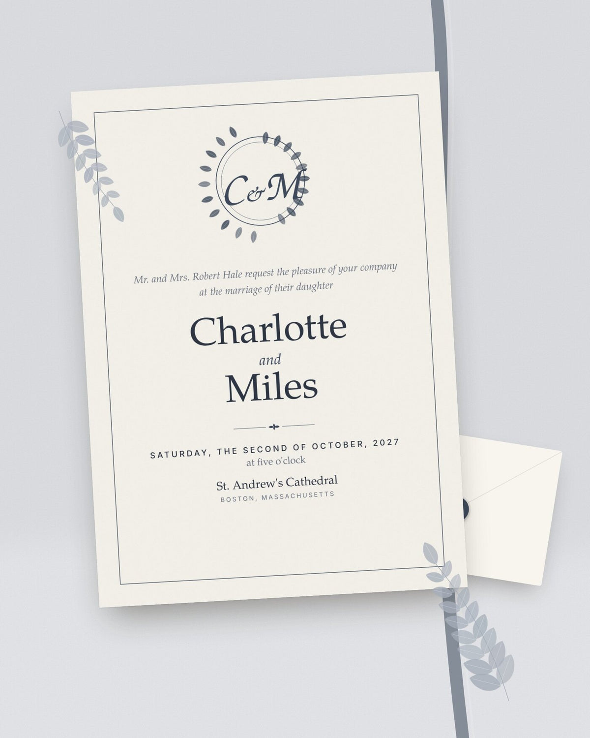 Crest classic monogram wedding invitation, styled flat-lay with envelope