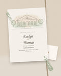 Custom illustrated venue wedding invitation with line-art manor, styled flat-lay