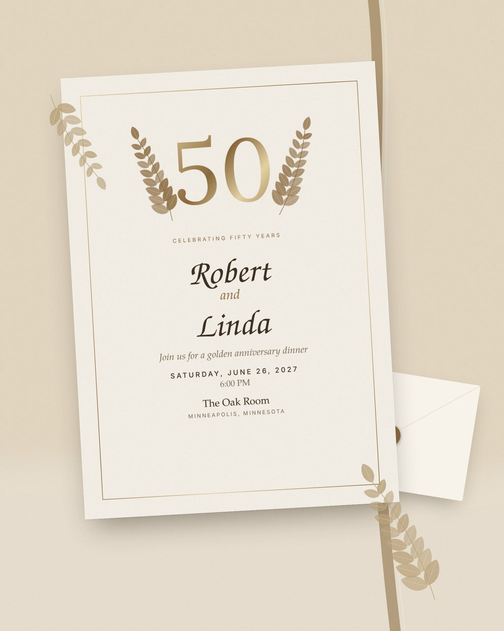 Golden Years 50th anniversary invitation with gold laurels, styled flat-lay