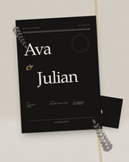 Noir Modern black and white wedding invitation, styled flat-lay with black envelope